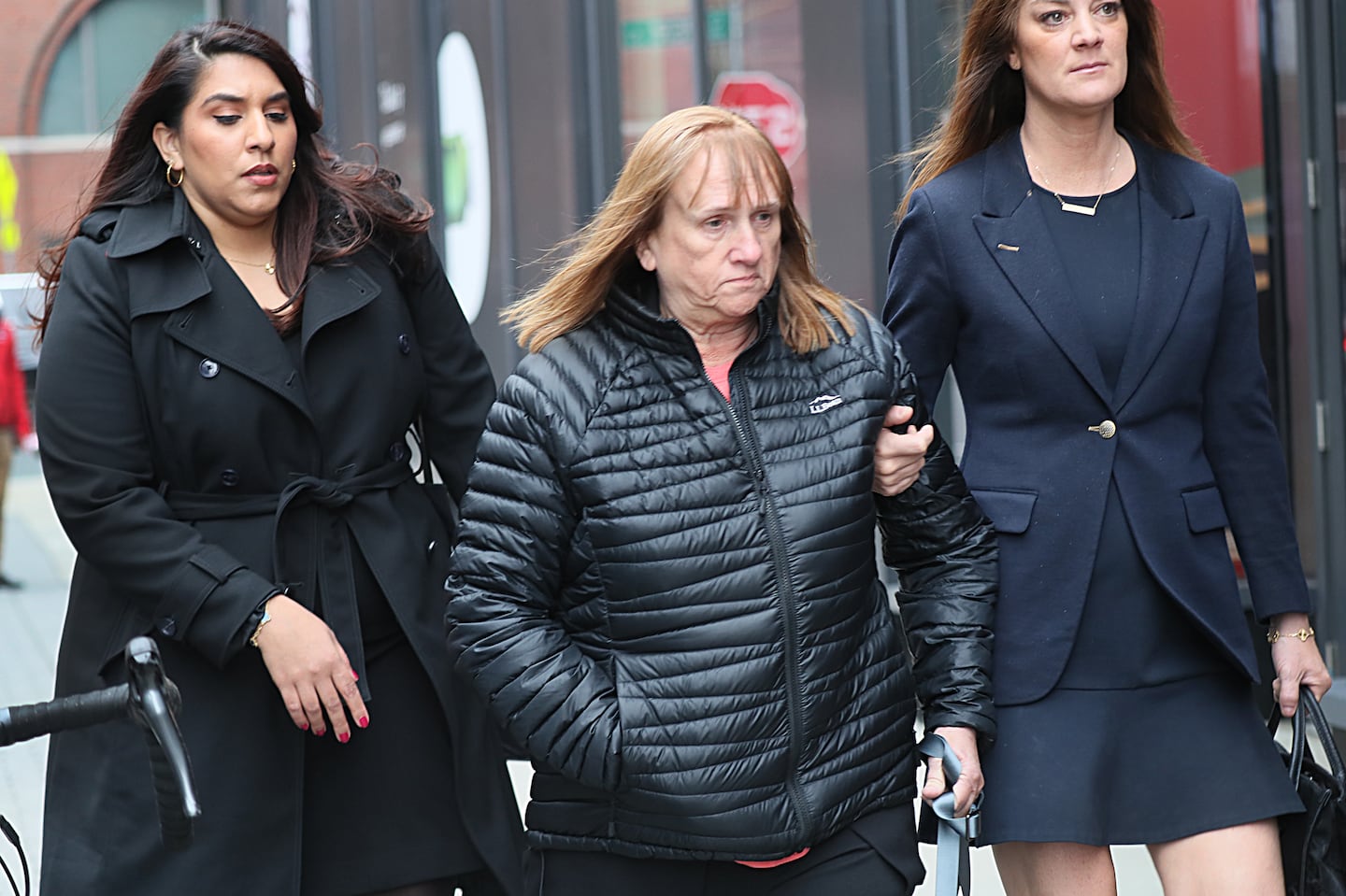 Reba Daoust, shown leaving US District Court in Boston last year, is one of three former Magellan executives who have pleaded not guilty to charges they knowingly sold faulty lead test devices.