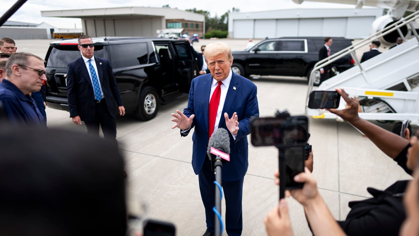 Former president Donald Trump, the Republican nominee for president, spoke to reporters after a visit about recovery from Hurricane Helene in Evans, Ga., on Oct. 4.