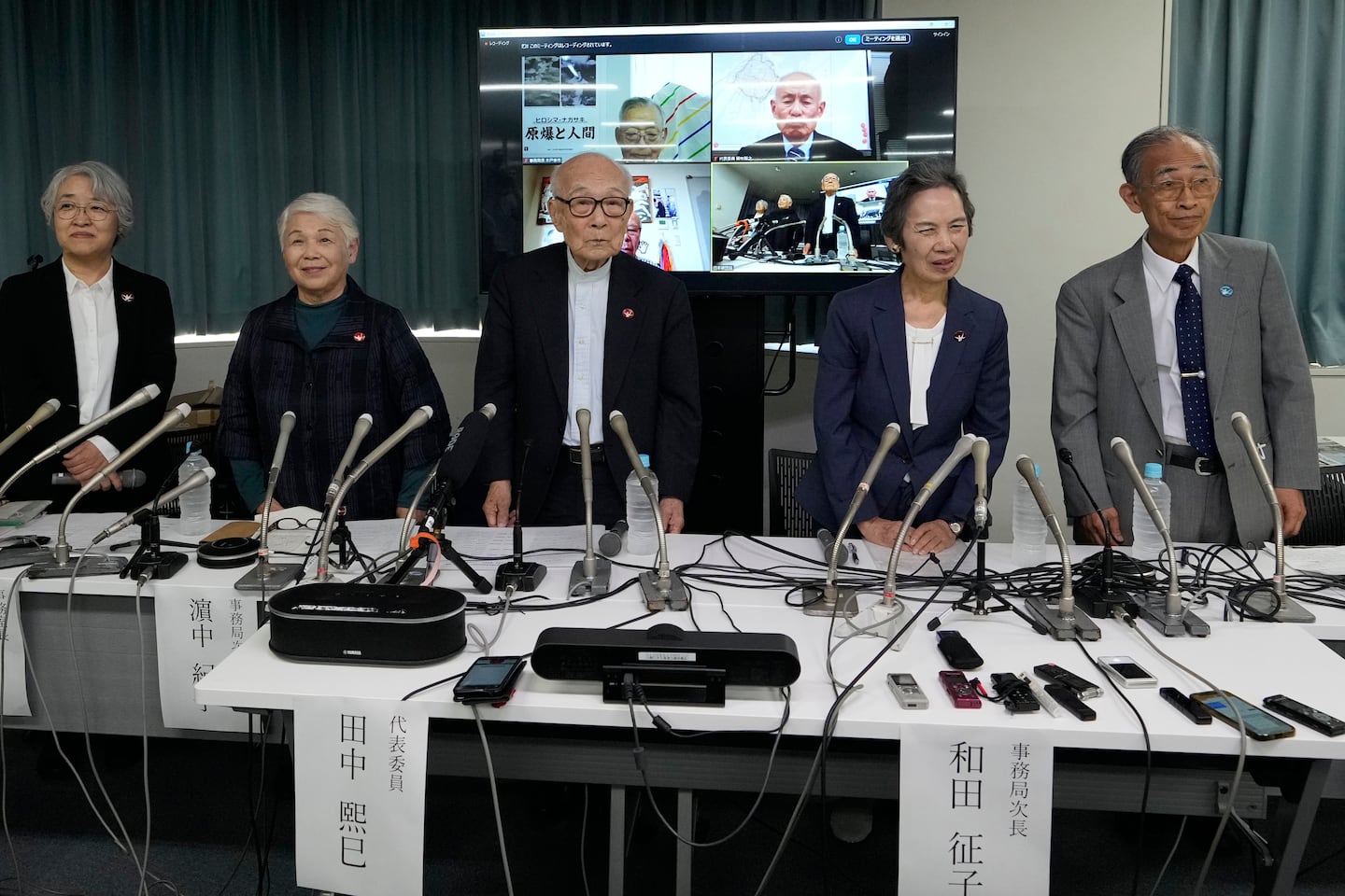 Terumi Tanaka, center, co-chairperson of Nihon Hidankyo and other senior members attend a press conference in Tokyo, on Oct. 12, a day after Nihon Hidankyo, an organization of survivors of the two U.S. atomic bombings, won the Nobel Peace Prize. Other members from second left to right, assistant Secretary Generals Toshiko Hamanaka, Masako Wada, and Jiro Hamasumi.