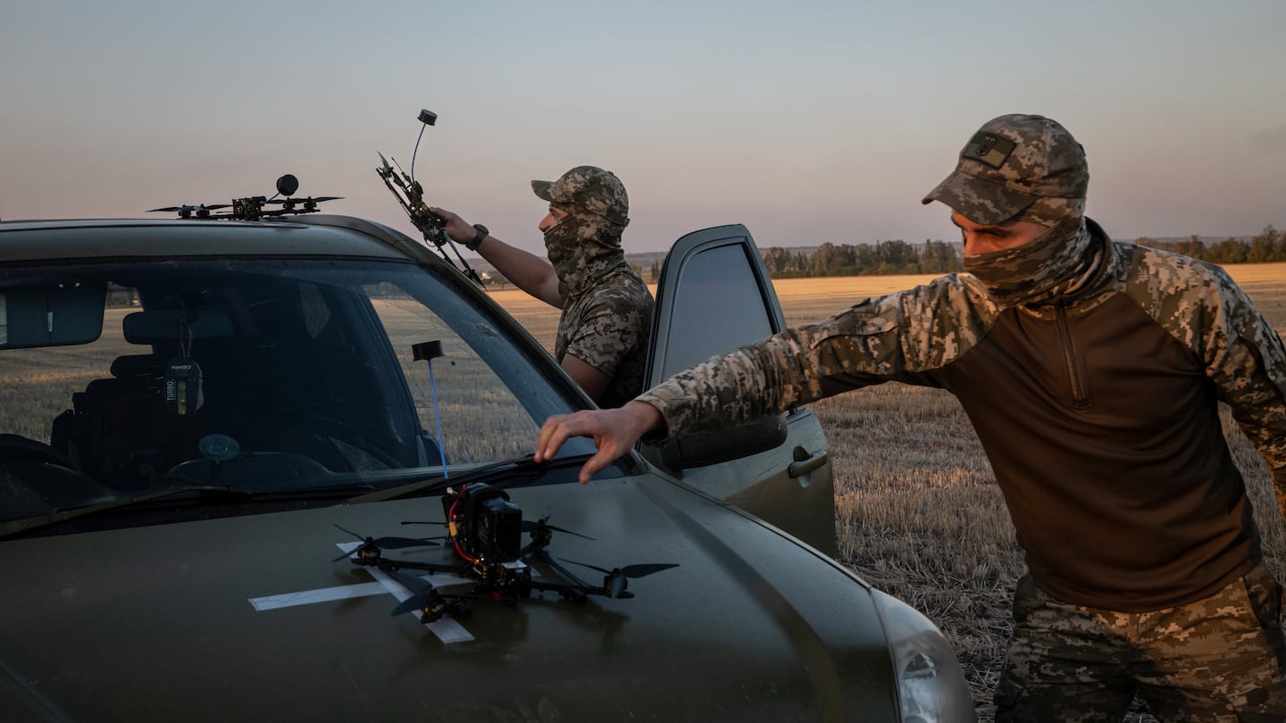 Ukrainian drone operators prepared to test a new drone in Donetsk region, Ukraine, last month. Drones are getting another new twist: Soldiers attach canisters to them to create weapons capable of spitting out molten metal that burns at 4,400 degrees.