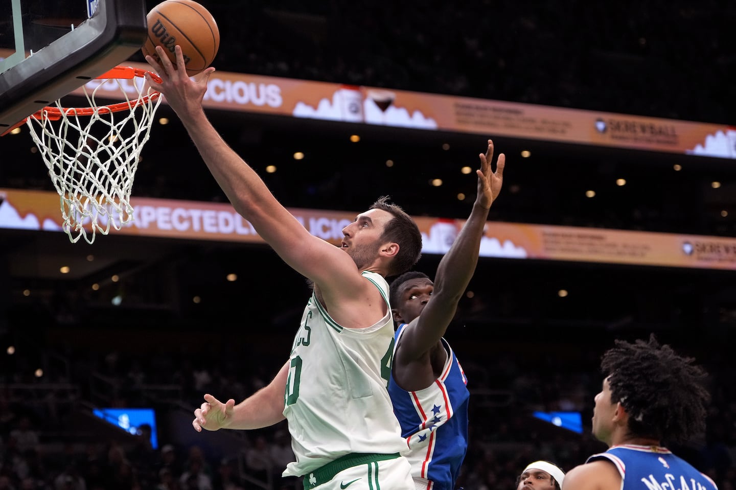 Boston Celtics center Luke Kornet (40) drives for a layup during the second quarter.