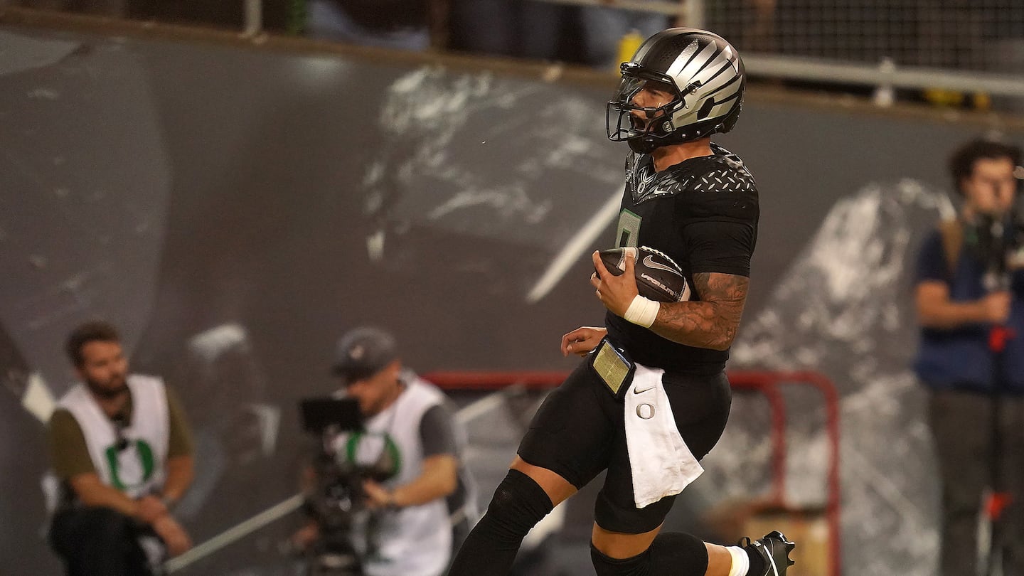 Oregon quarterback Dillon Gabriel reacts scoring a 27-yard touchdown run early in the fourth quarter of the Ducks' 32-31 win over Ohio State.