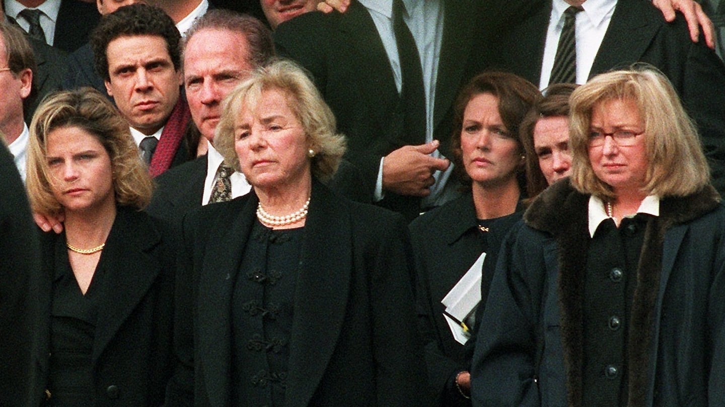 Ethel Kennedy (center), holds hands with Victoria Gifford, her daughter-in-law, and other members of the Kennedy family watch as Michael Kennedy's casket leaves Our Lady of Victory Parish in Centerville in 1998.