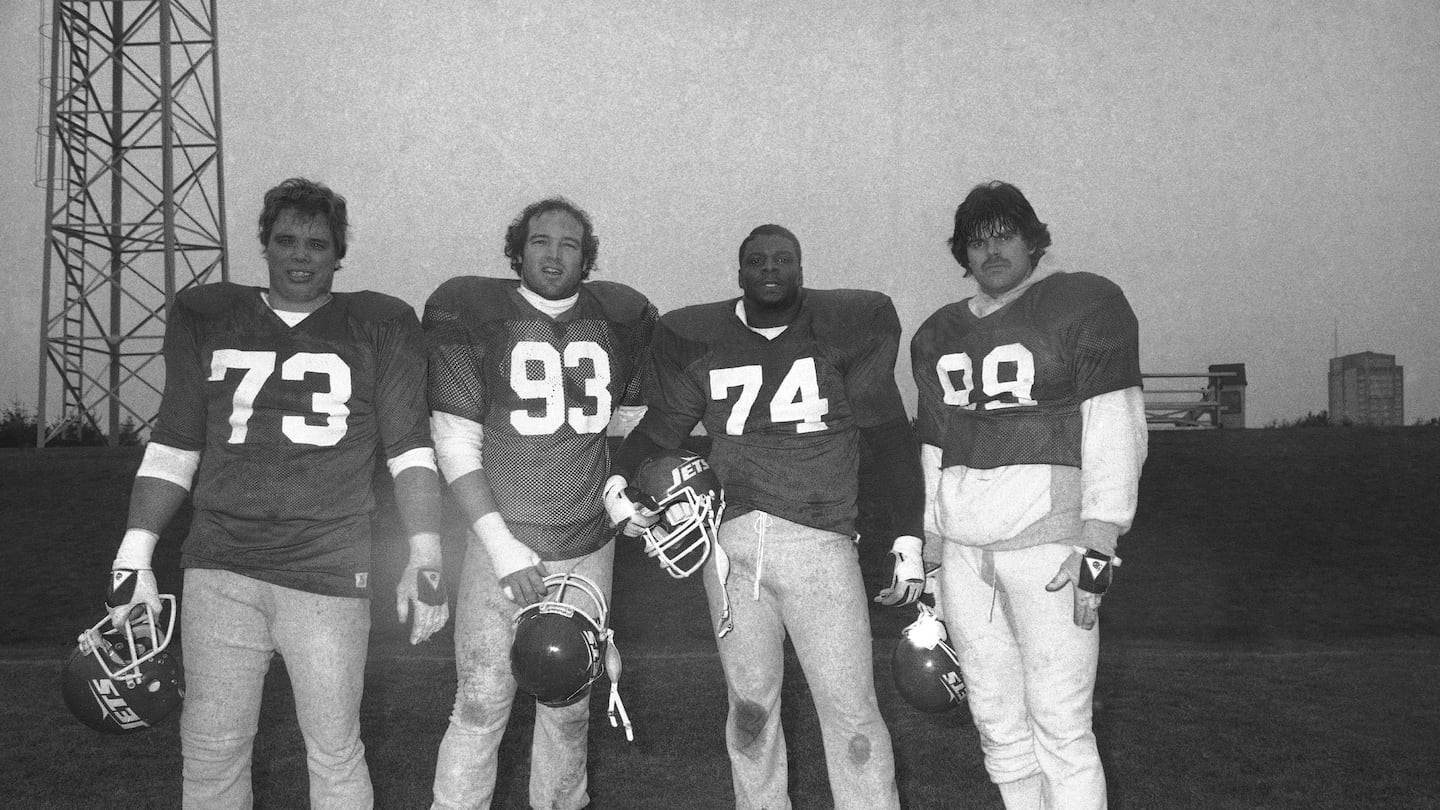 Mr. Salaam (third from left) is seen in 1982 with fellow New York Jets players (from left) defensive end Joe Klecko, defensive tackle Marty Lyons, and defensive end Mark Gastineau.