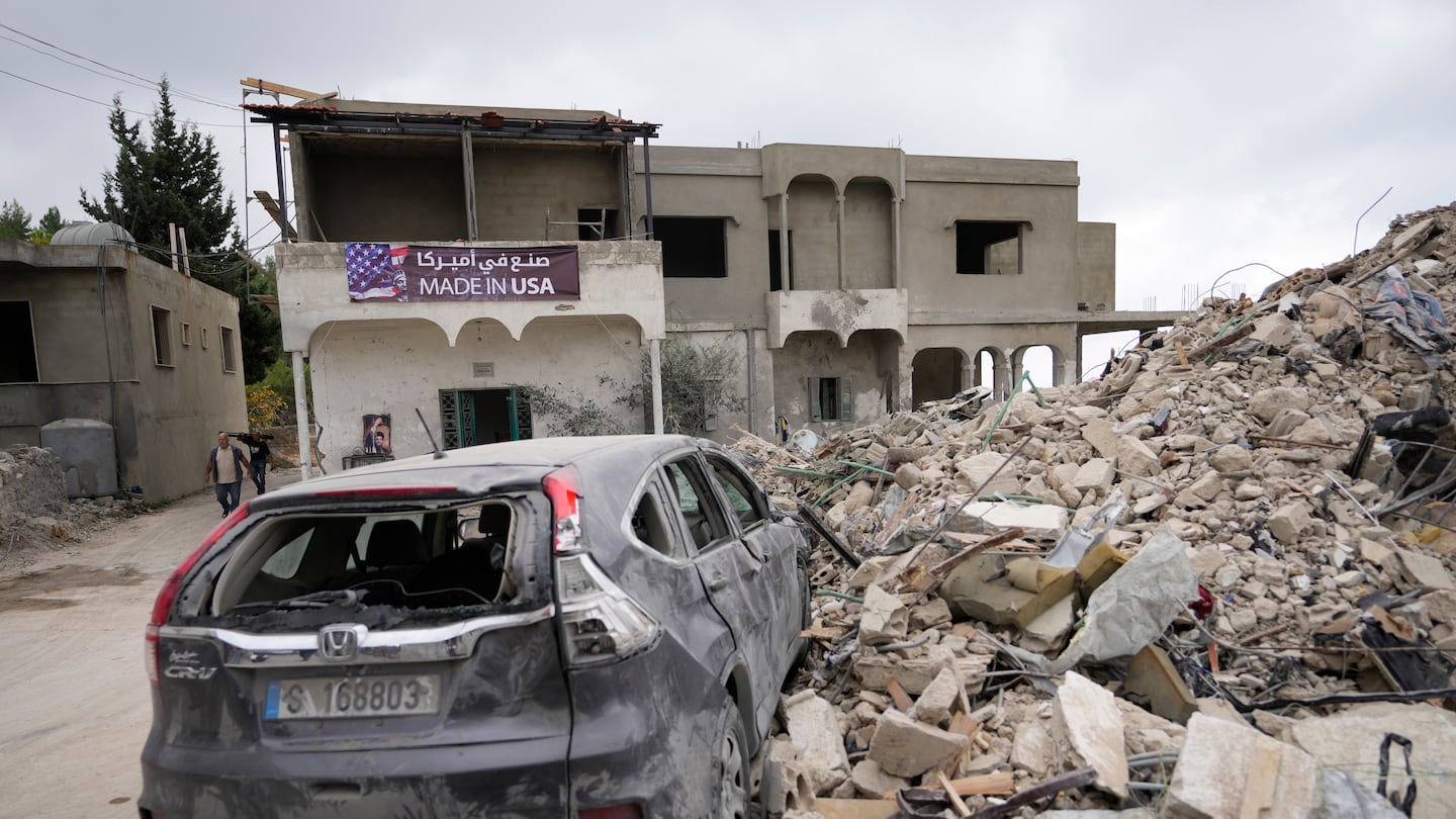 A car sits on the rubble of a building damaged in an Israeli airstrike, in Maisara near the northern coastal town of Byblos, Lebanon, Monday, Oct. 14, 2024.