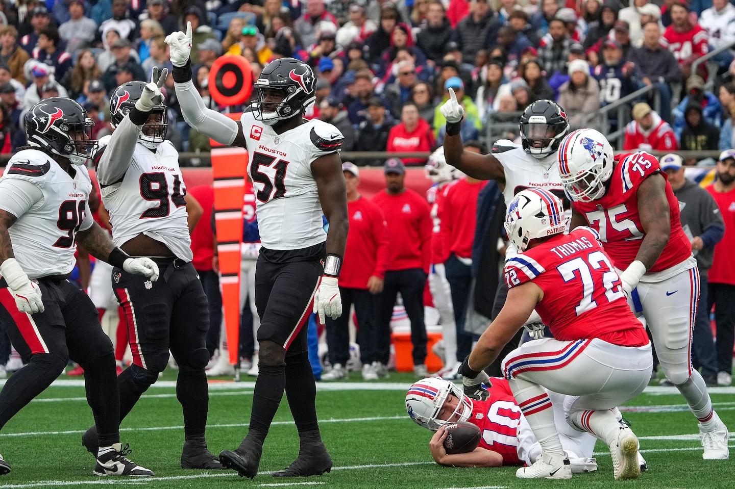 Drake Maye (bottom right) was sacked four times and hit eight times but kept getting up.