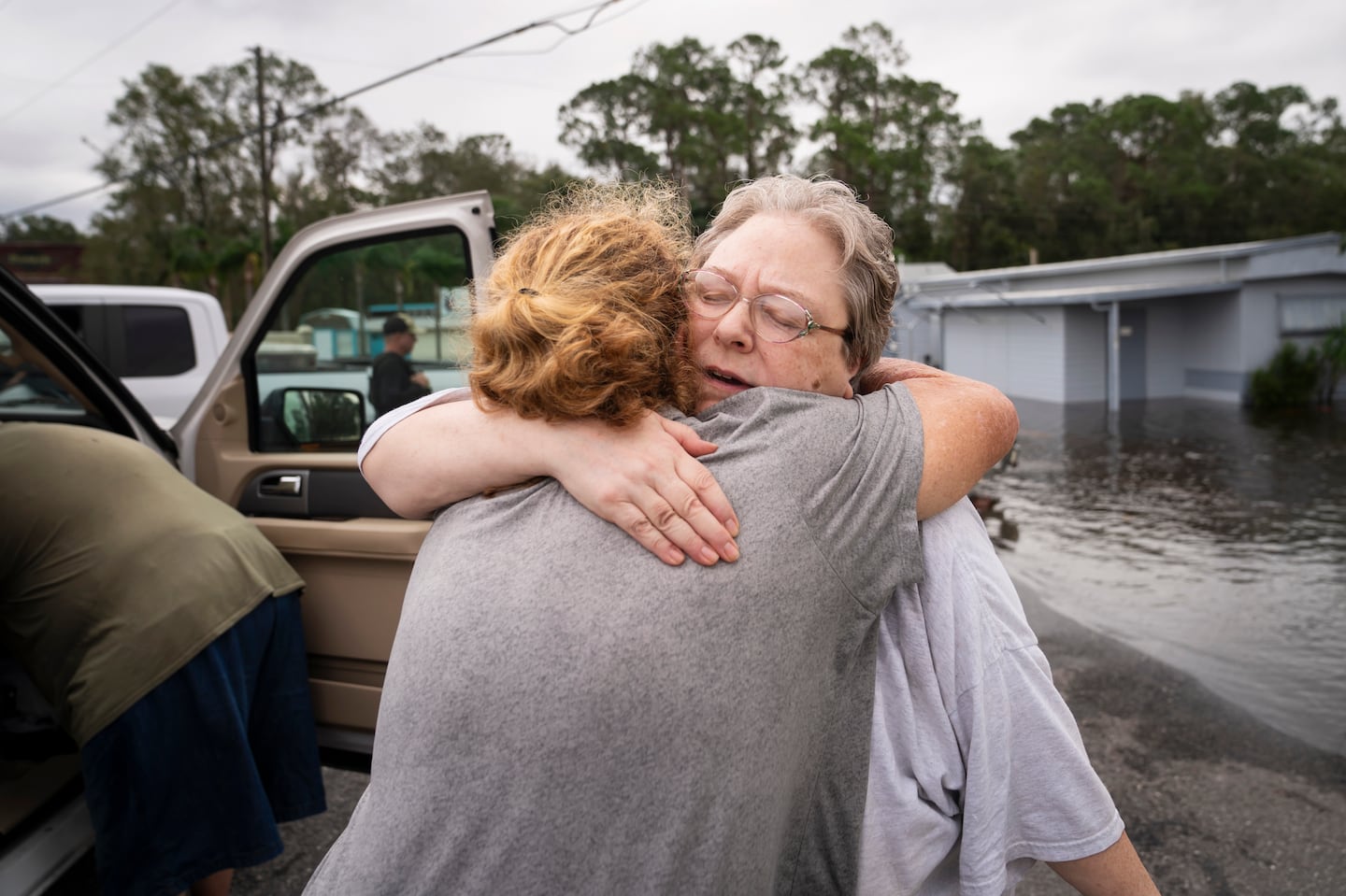 Donna Clark hugs her neighbor Mary Miller after being rescued from Hurricane Milton floodwaters by Lakeland Police Department at the Buccaneer Bay mobile home park, in Lakeland, Fla. on Thursday, Oct. 10, 2024.