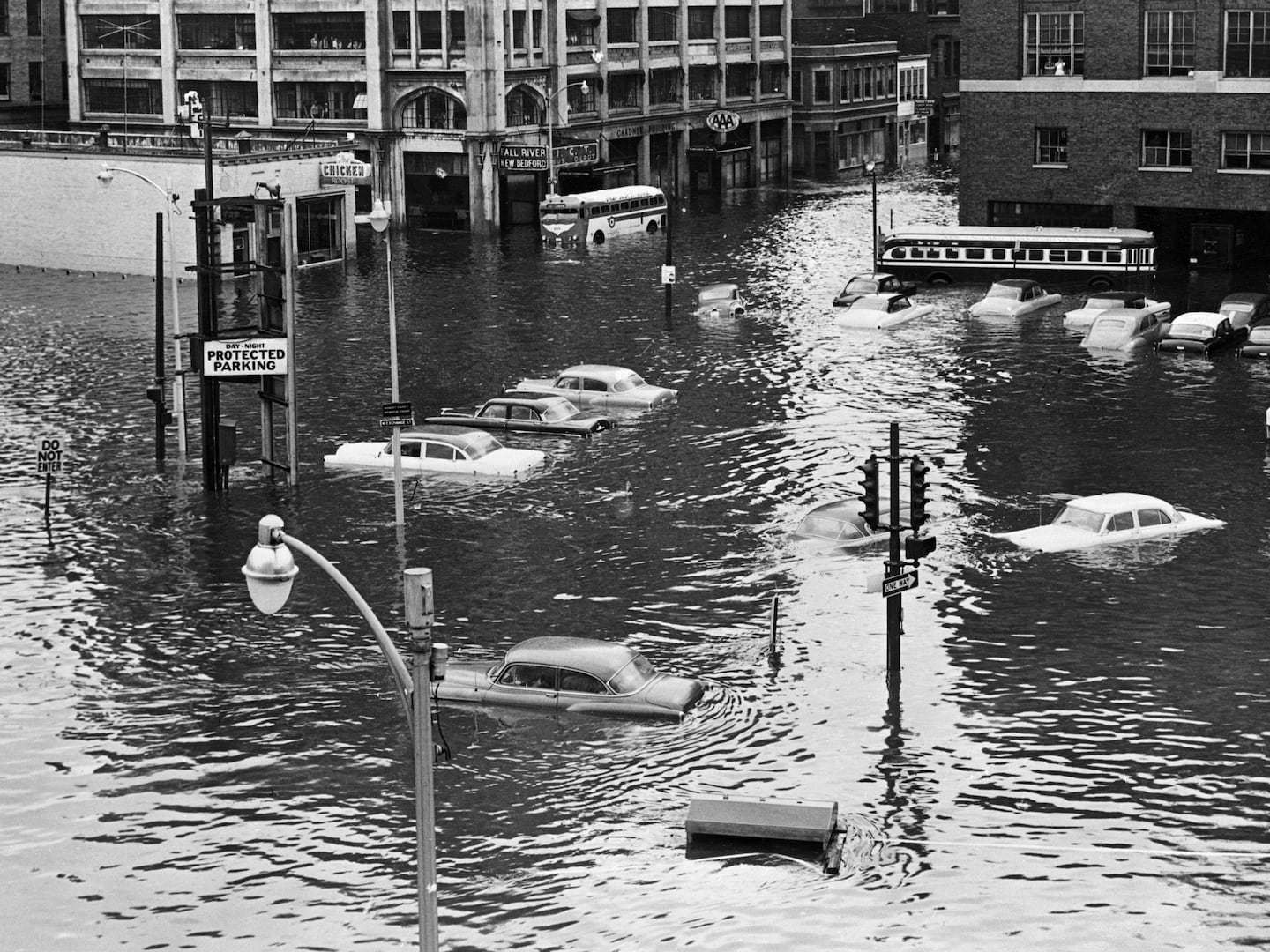 Providence suffered great damage when Hurricane Carol hit New England in 1954. Cars were surrounded by flood waters near Union Station.