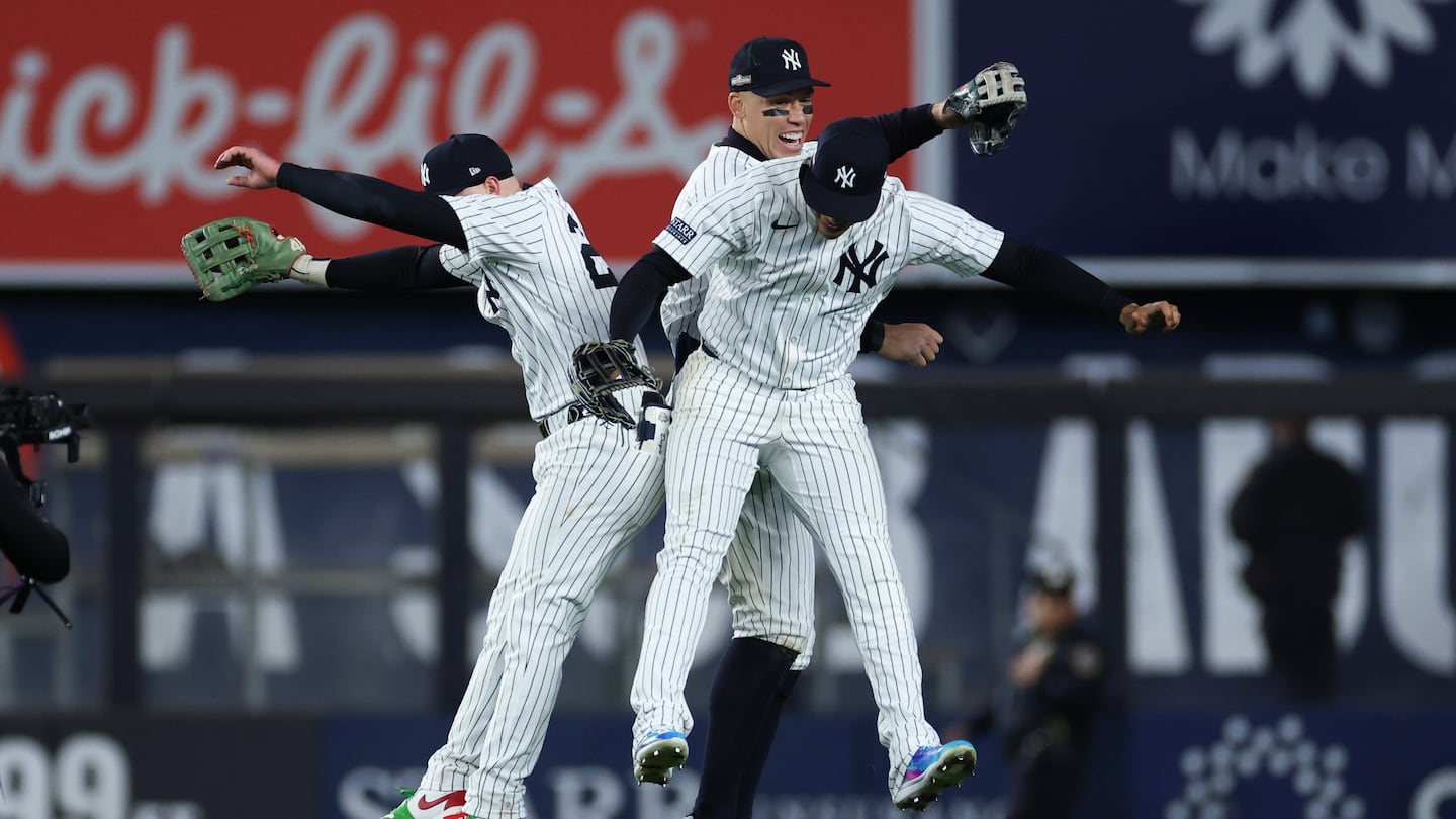 Yankees outfielders (from left) Alex Verdugo, Aaron Judge, and Juan Soto celebrate as New York won Game 1 of the American League Championship Series against the Guardians.