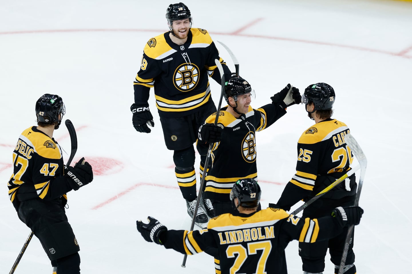 A second-period tying goal by defenseman Brandon Carlo (right) was cause for celebration, but the Bruins soon fell behind again.