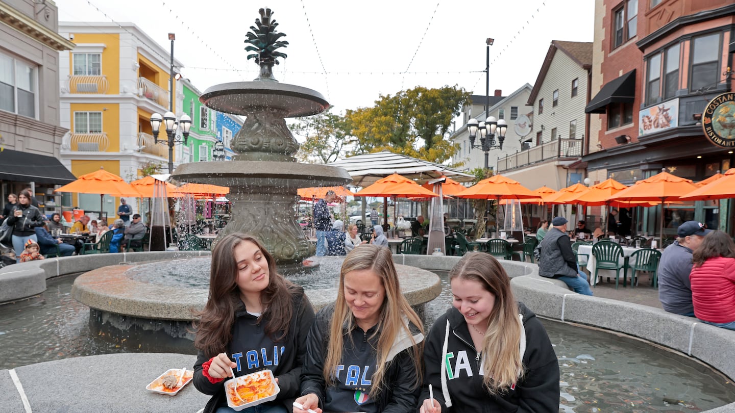 Venda Ravioli was the draw for (from left) Lauren Flanagan, her mother, Ann Marie Flanagan, of Douglas, and their friend Nicole Charron, of Goffstown, N.H., at Providence's 39th Annual Columbus Day Festival and Parade.