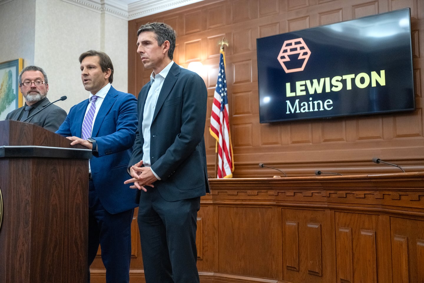 Attorneys Ben Gideon, left center, and Travis Brennen, center, addressed reporters after the release of the Independent Commission to Investigate the Facts of the Tragedy in Lewiston report on Aug. 20.