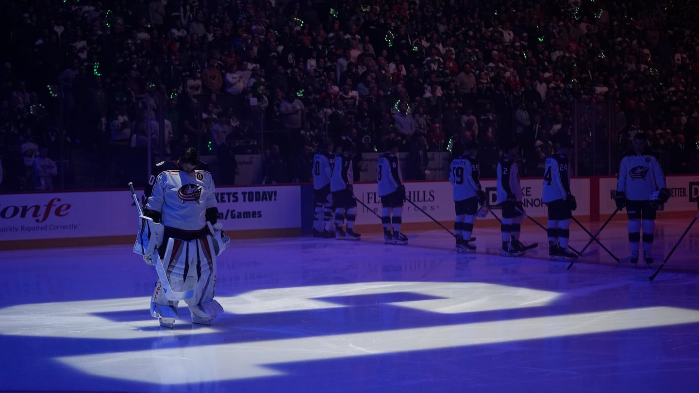 Columbus Blue Jackets goaltender Elvis Merzlikins stood on a No. 13 on the ice honoring Johnny Gaudreau before a game against the Minnesota Wild on Oct. 10.