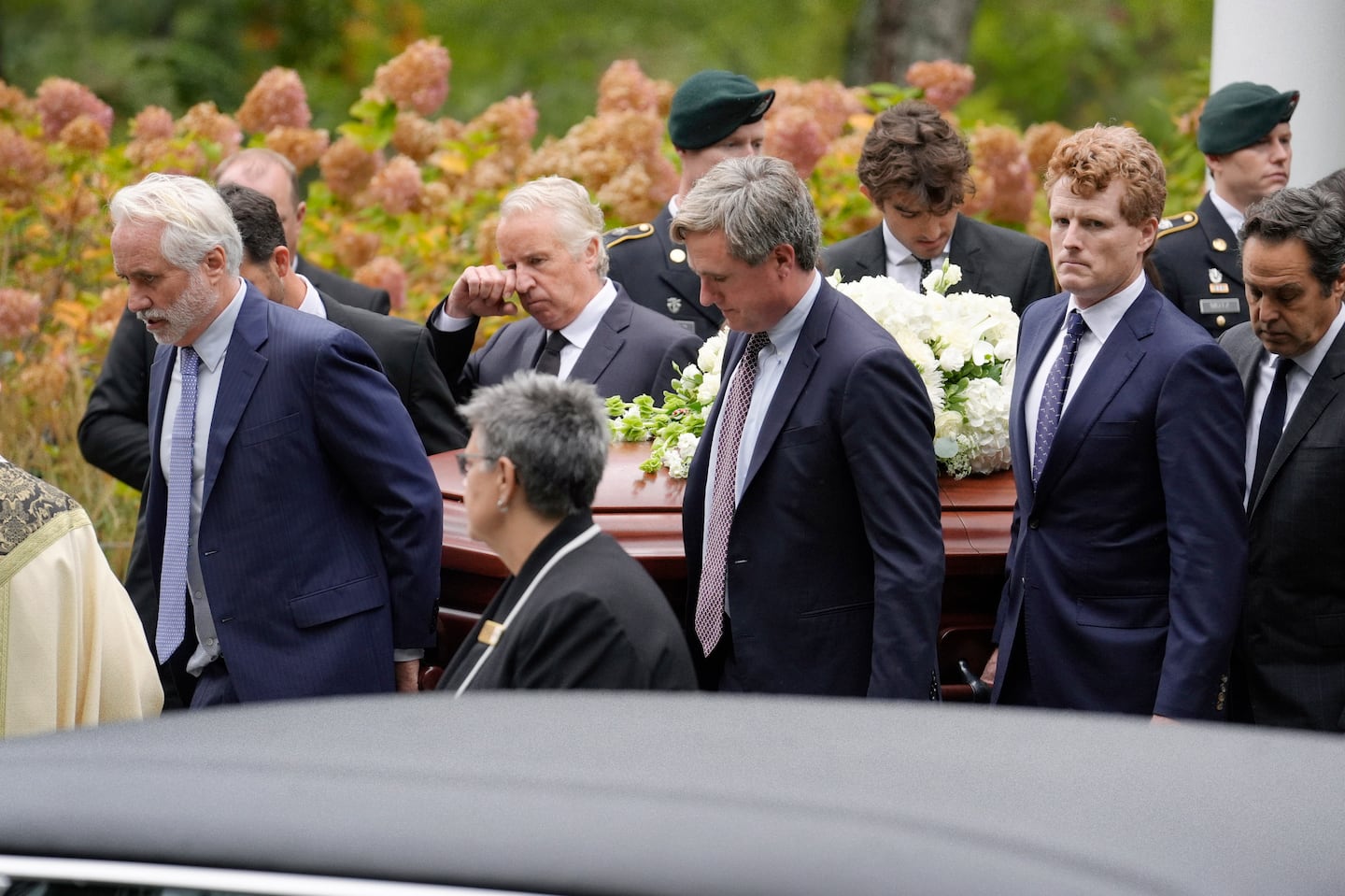 Pallbearers Max Kennedy (left), Chris Kennedy (behind center left), Matt Kennedy (center front), and Joseph Kennedy III (front second from right) carried her casket from Our Lady of Victory church following funeral services on Monday in Centerville.