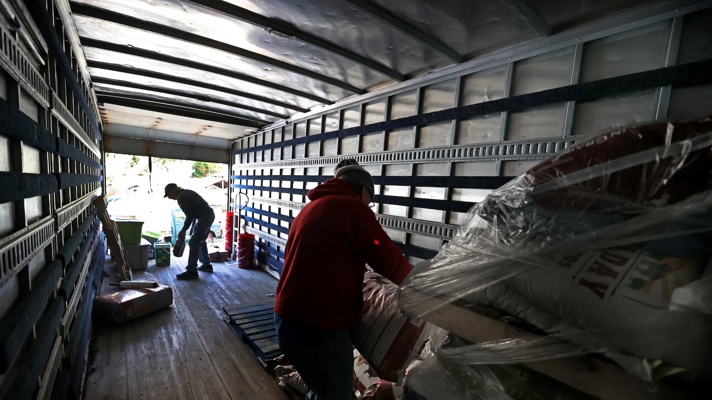 Volunteers Frank Weller and Jamie Oliver helped pack up a truck in Marshfield Tuesday, as Teamsters Local 25 and the Magical Moon Farm & Foundation are working to provide relief supplies to areas devastated by Hurricane Helene.