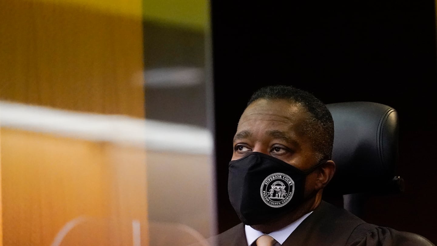 Judge Thomas A. Cox. Jr. listens to a plaintiff in a Fulton County Courthouse on Friday, Nov. 18, 2022, in Atlanta.