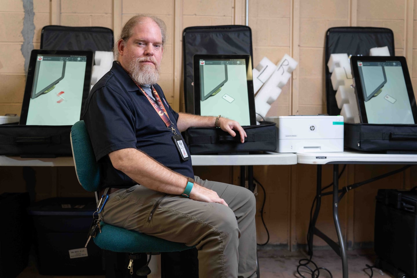 Thomas Gillon, the elections supervisor for Georgia's Macon-Bibb County, with touchscreen ballot-marking machines before the 2022 midterms.