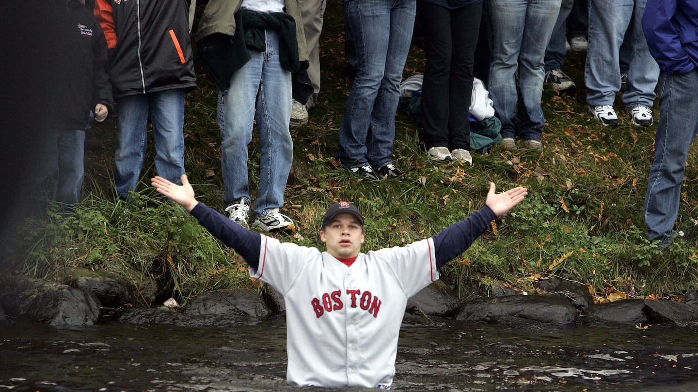 This Red Sox fan, appearing to be baptized in the Charles River, represented countless others who felt reborn when the team ended its championship drought in 2004.