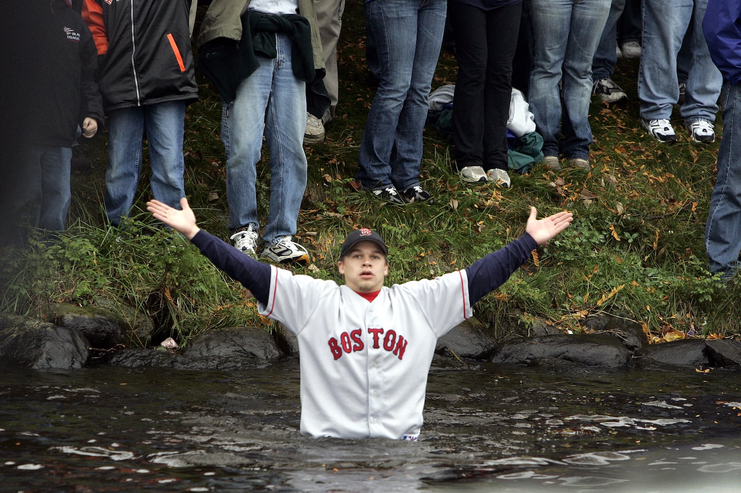 This Red Sox fan, appearing to be baptized in the Charles River, represented countless others who felt reborn when the team ended its championship drought in 2004.