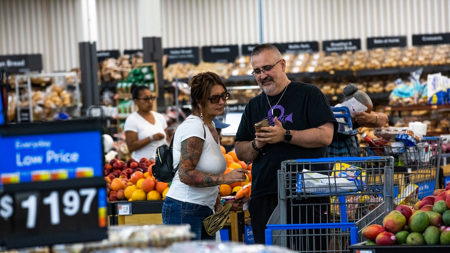 Shoppers paused in the produce section at a Walmart Superstore in Secaucus, N.J., July 11.