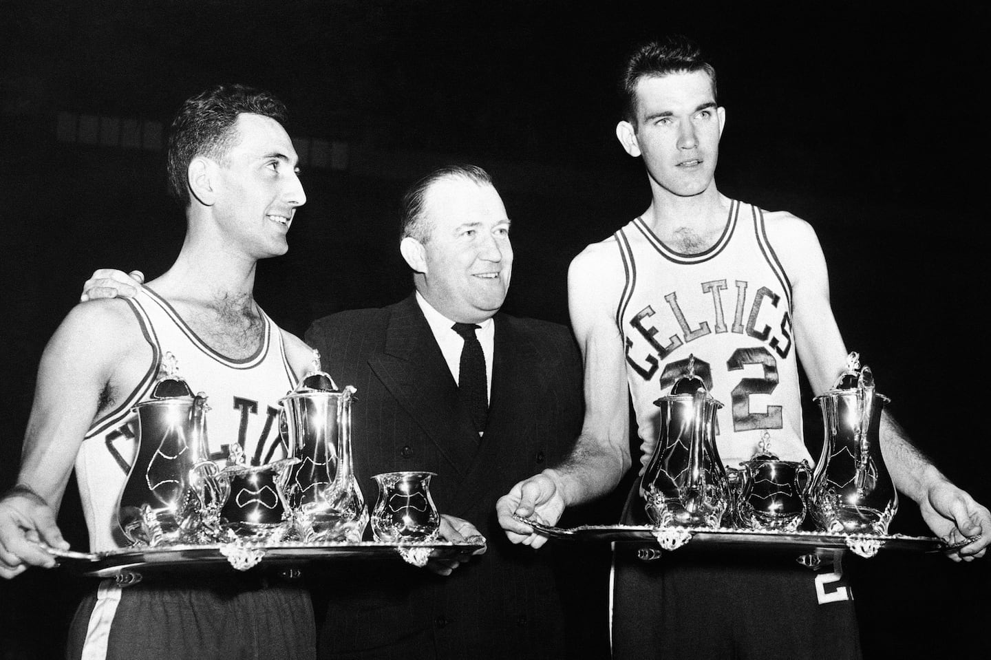 Celtics owner Walter Brown (center, with Bob Cousy on the left and Ed Macauley on the right receiving sterling silver tea services in 1952) is said to have landed on the name for his pro basketball team after a burst of inspiration.