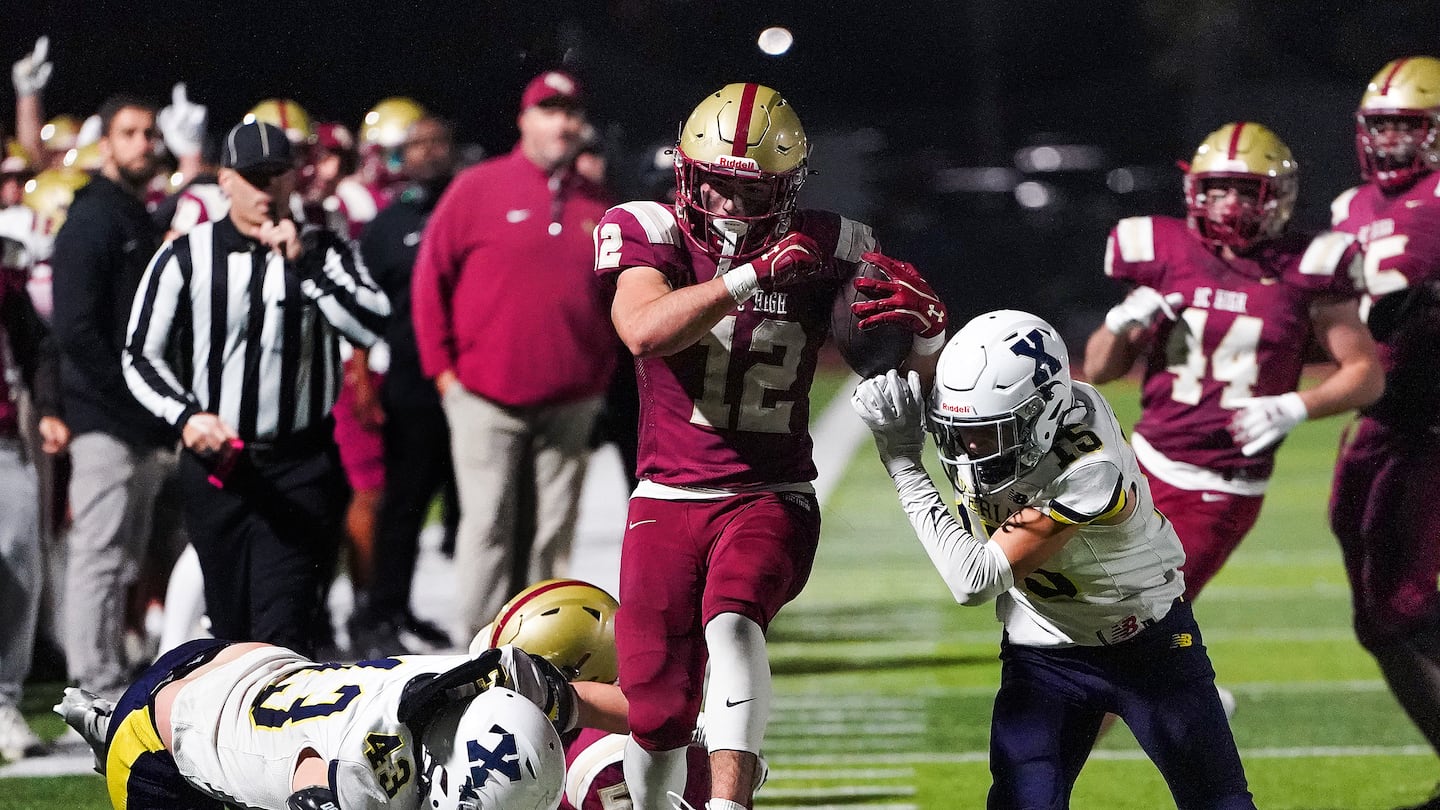 BC High’s Jackson Richard straddles the sideline on a fourth-quarter run that left several Xaverian defenders in his his wake during Friday's 30-13 victory over the third-ranked Hawks.