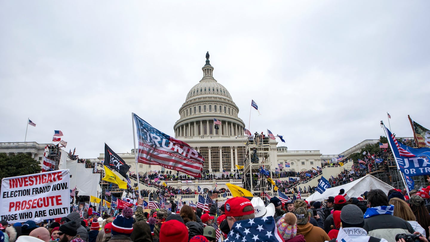 People attack the U.S. Capitol in Washington, on Jan. 6, 2021.