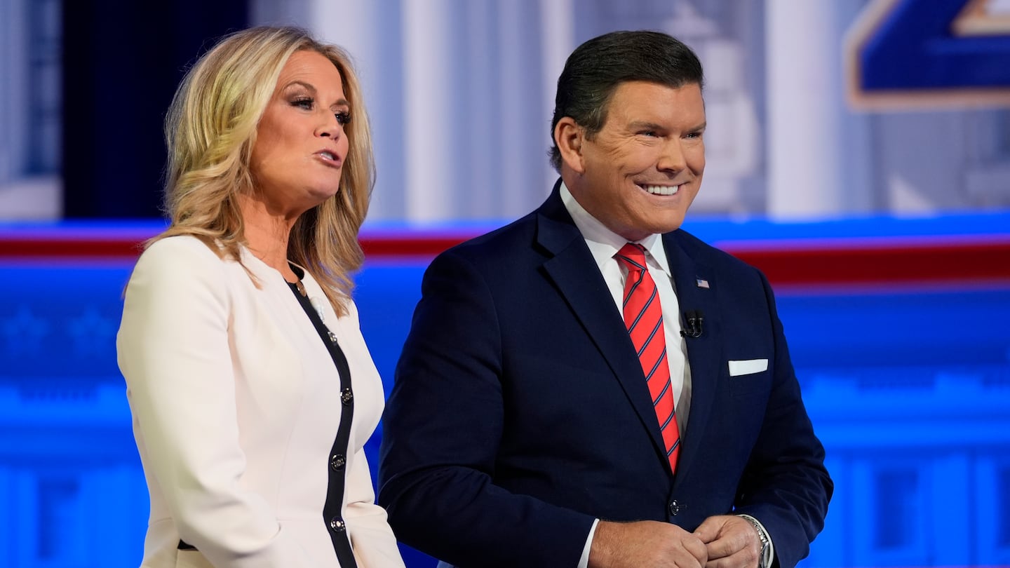 Moderators Martha MacCallum and Bret Baier appear before Republican presidential candidate former president Donald Trump speaks during a Fox News Channel town hall in Des Moines, Iowa, Jan. 10, 2024.