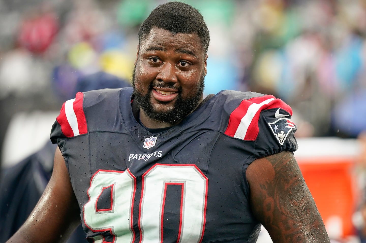 New England Patriots defensive tackle Christian Barmore stands on the sideline during an NFL football game against the New York Jets on Sunday Sept. 24, 2023, in New York.