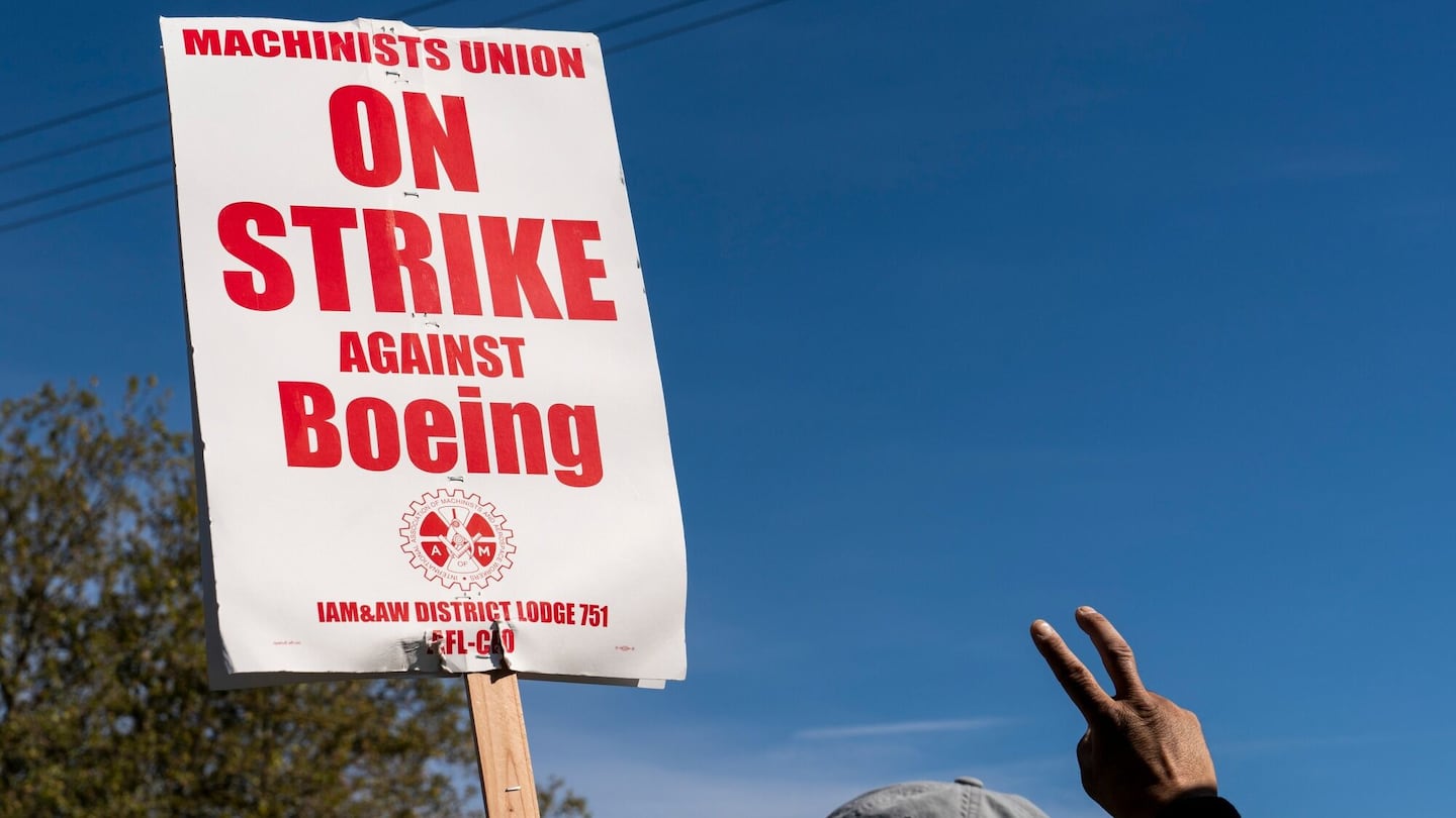 A worker pickets outside the Boeing Co. manufacturing facility during a strike in Renton, Washington, US, on Thursday, Oct. 3, 2024.