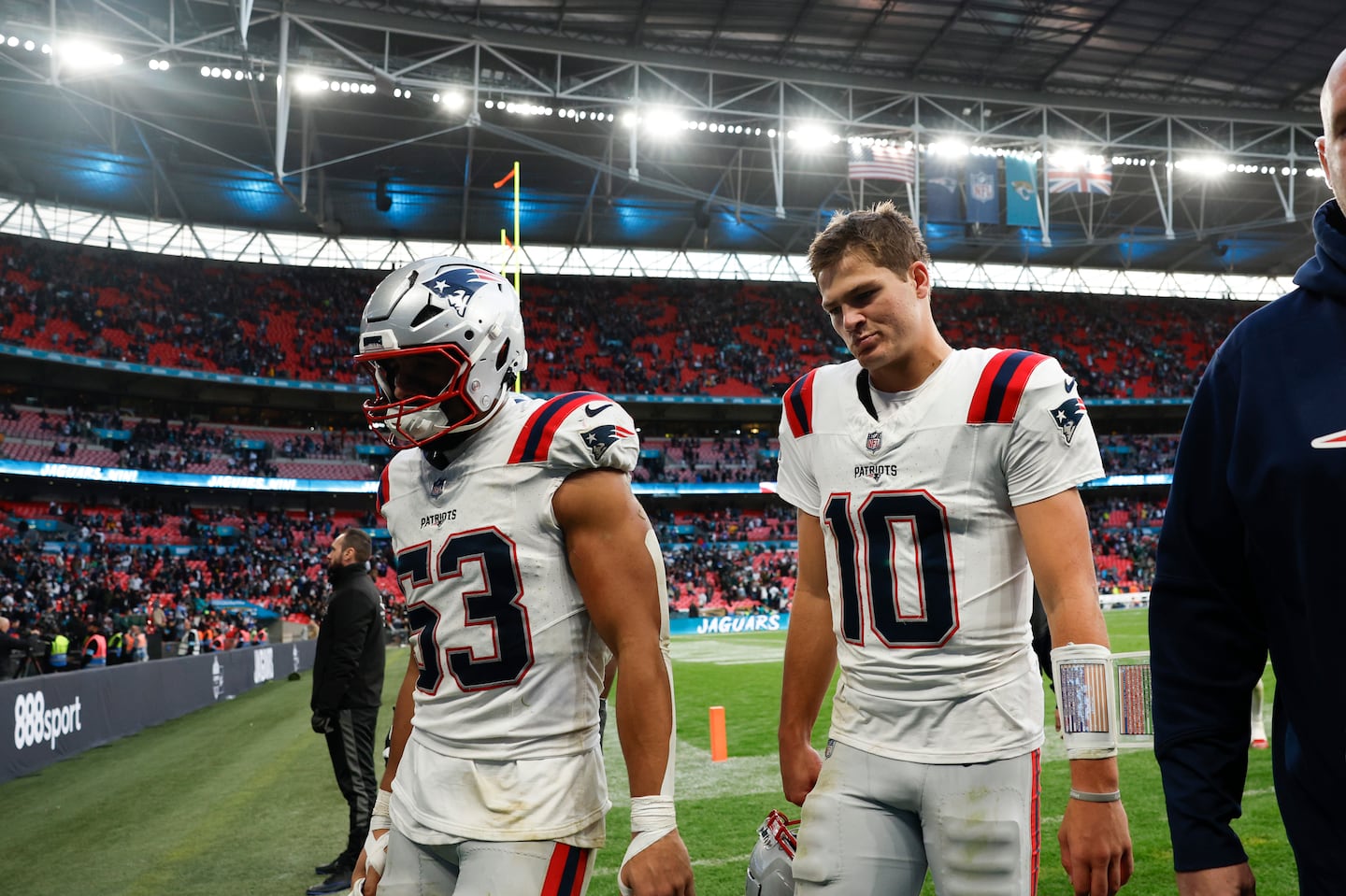 Drake Maye (right) shows promise for the future, but presently there are only glum faces on the Patriots.