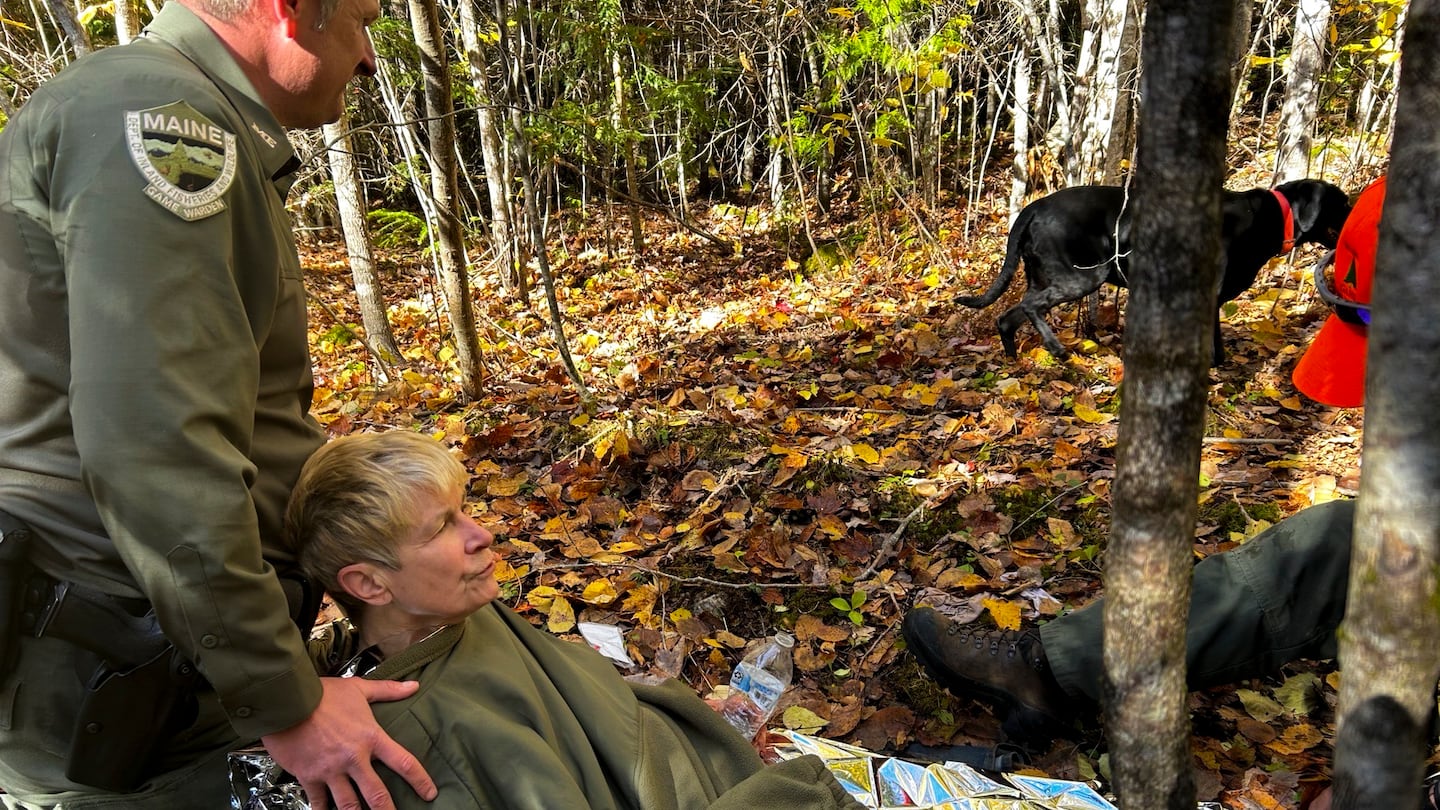 Pamela Helmstadter, 72, was carried by Maine game wardens rescuing her from the woods about a mile from her home.