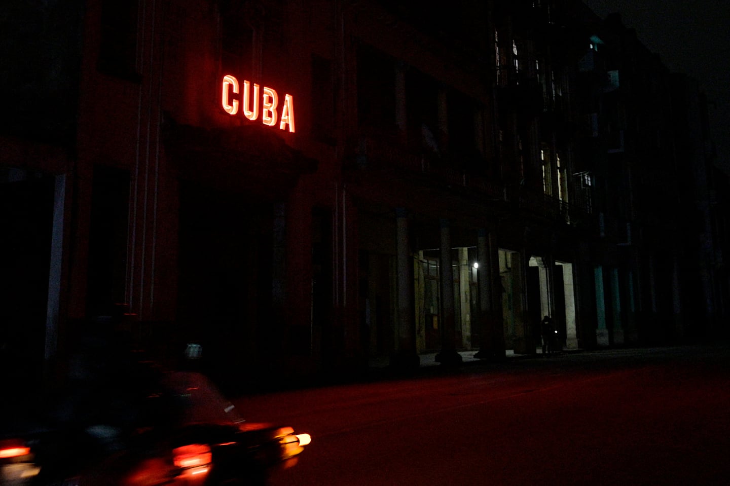 A sign lits a blacked out street during the second day of the nationwide blackout in Havana October 19, 2024.