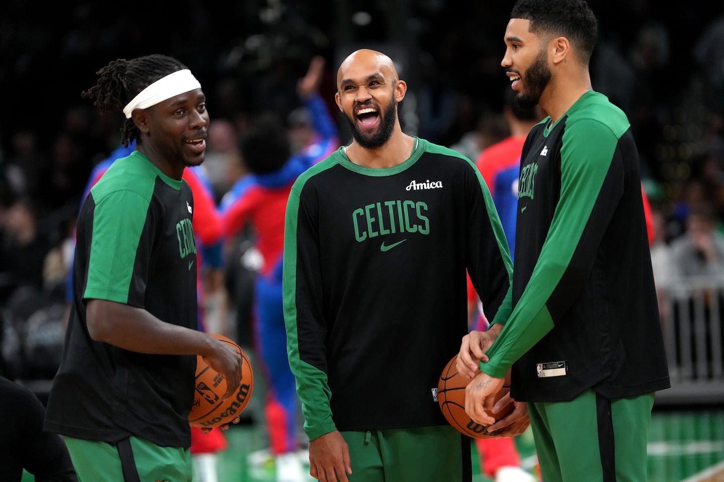 Jrue Holiday (left), Derrick White (center), and Jayson Tatum open the new season on Tuesday when the Celtics host the Knicks at TD Garden.