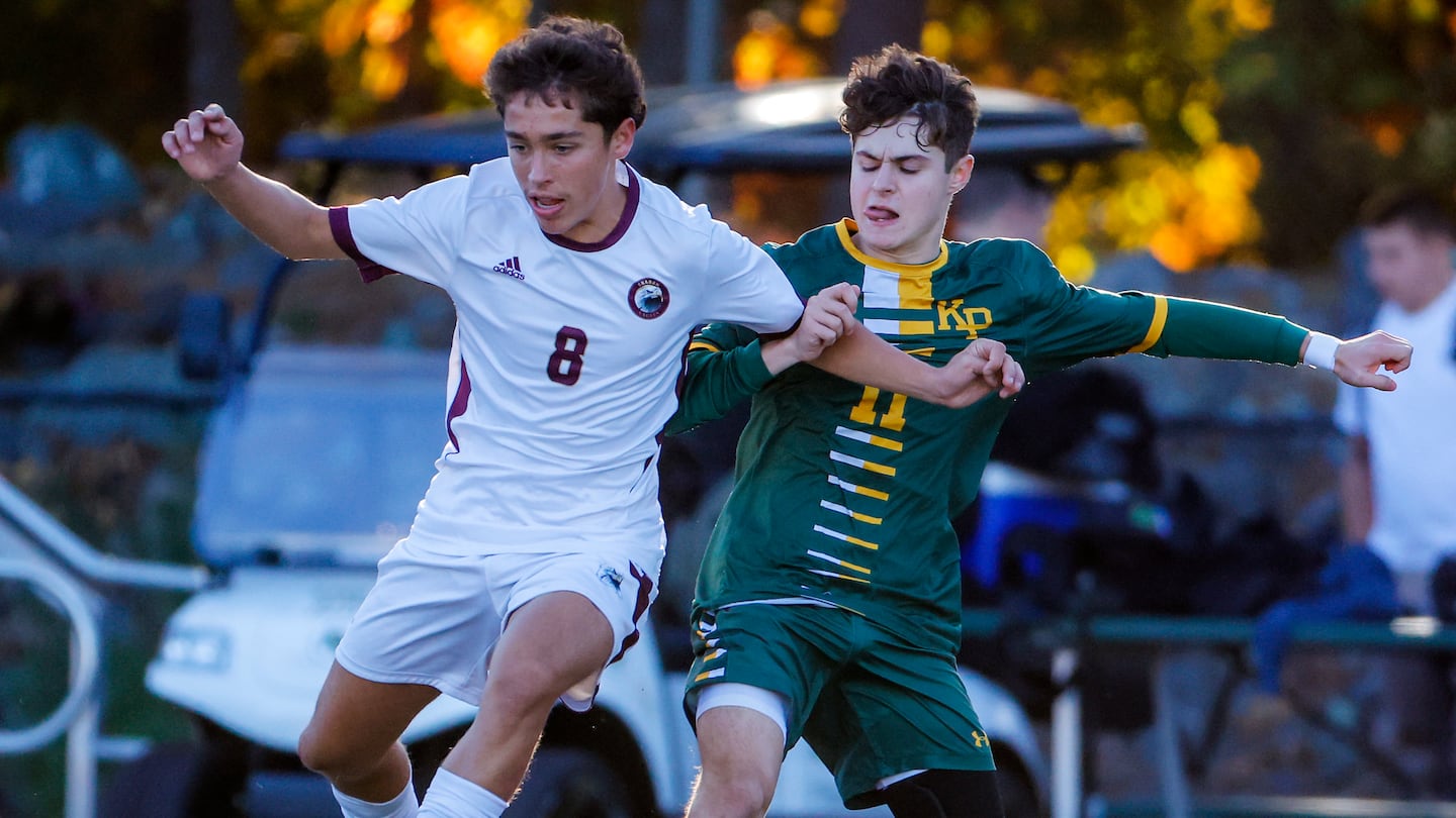 Sharon sophomore Neel Kapur (8) battles King Philip's Marco Amorim in the first half of Friday's Hockomock League matchup that Sharon won, 1-0, to lock up a trip to the state tournament.