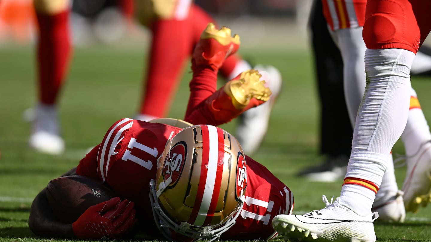 49ers wide receiver Brandon Aiyuk (11) remained on the field after being hit during the first half of Sunday's San Francisco loss to the Chiefs.