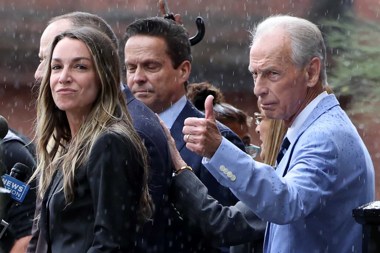 Karen Read (left) looked out as her father, William Read, gave a thumbs-up outside of Norfolk County Superior Court as they reacted to news that a mistrial was declared in her trial. She is set to be retried in January.