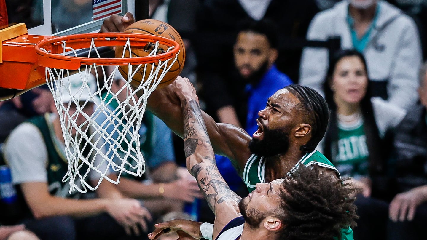 Jaylen Brown (right) and the Celtics are favored to repeat.