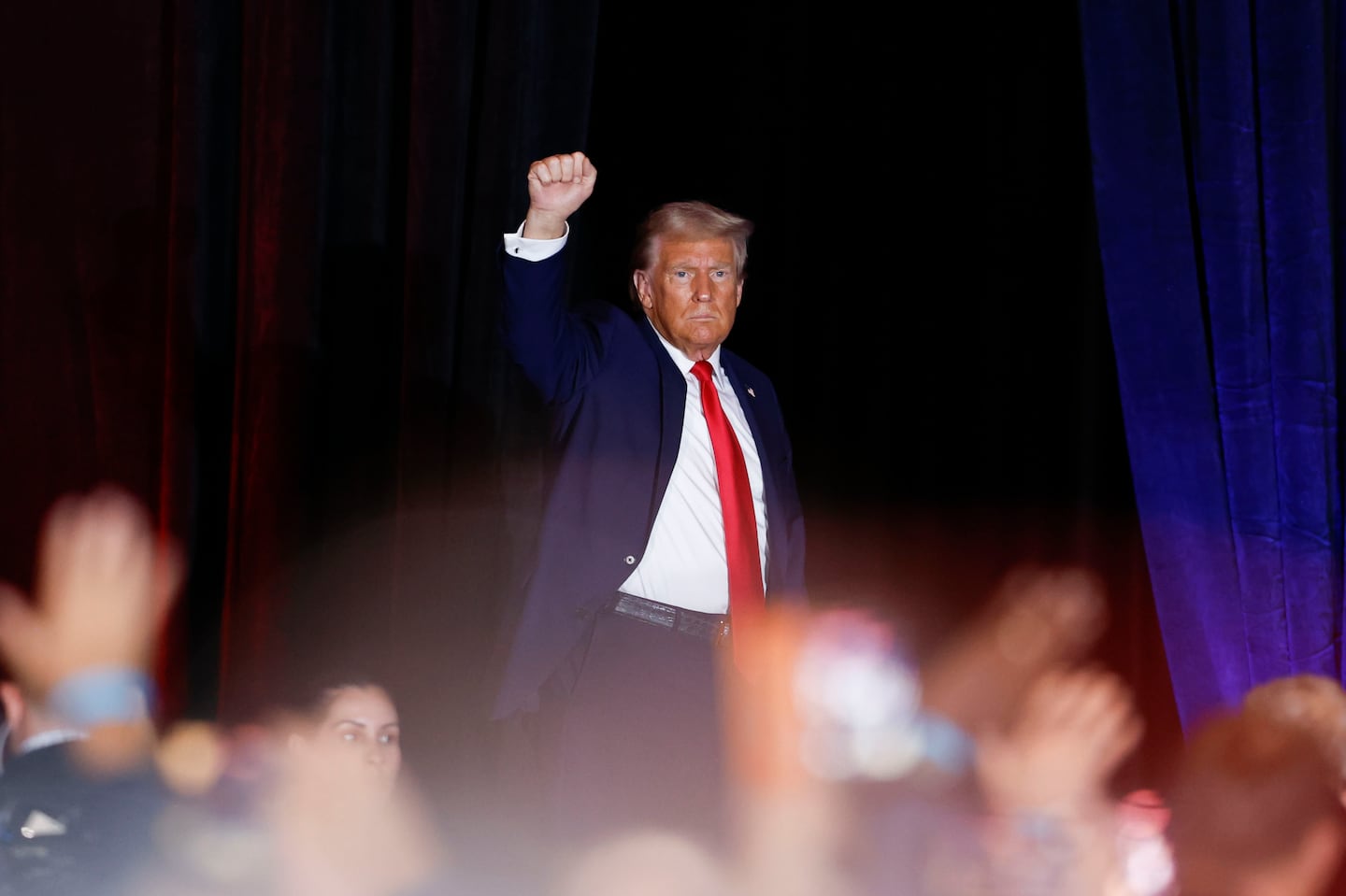 Republican presidential nominee former president Donald Trump gestures as he leaves the stage at a campaign rally in Concord, N.C., Monday, Oct. 21, 2024.