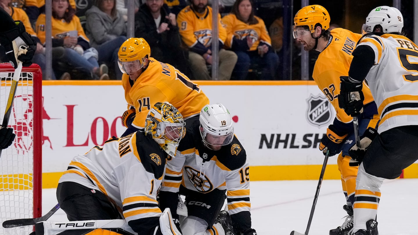 Johnny Beecher dropped in to help Bruins goalie Jeremy Swayman at the edge of the the crease, but the Predators' Tommy Novak (82) converted for the game's second goal nonetheless.