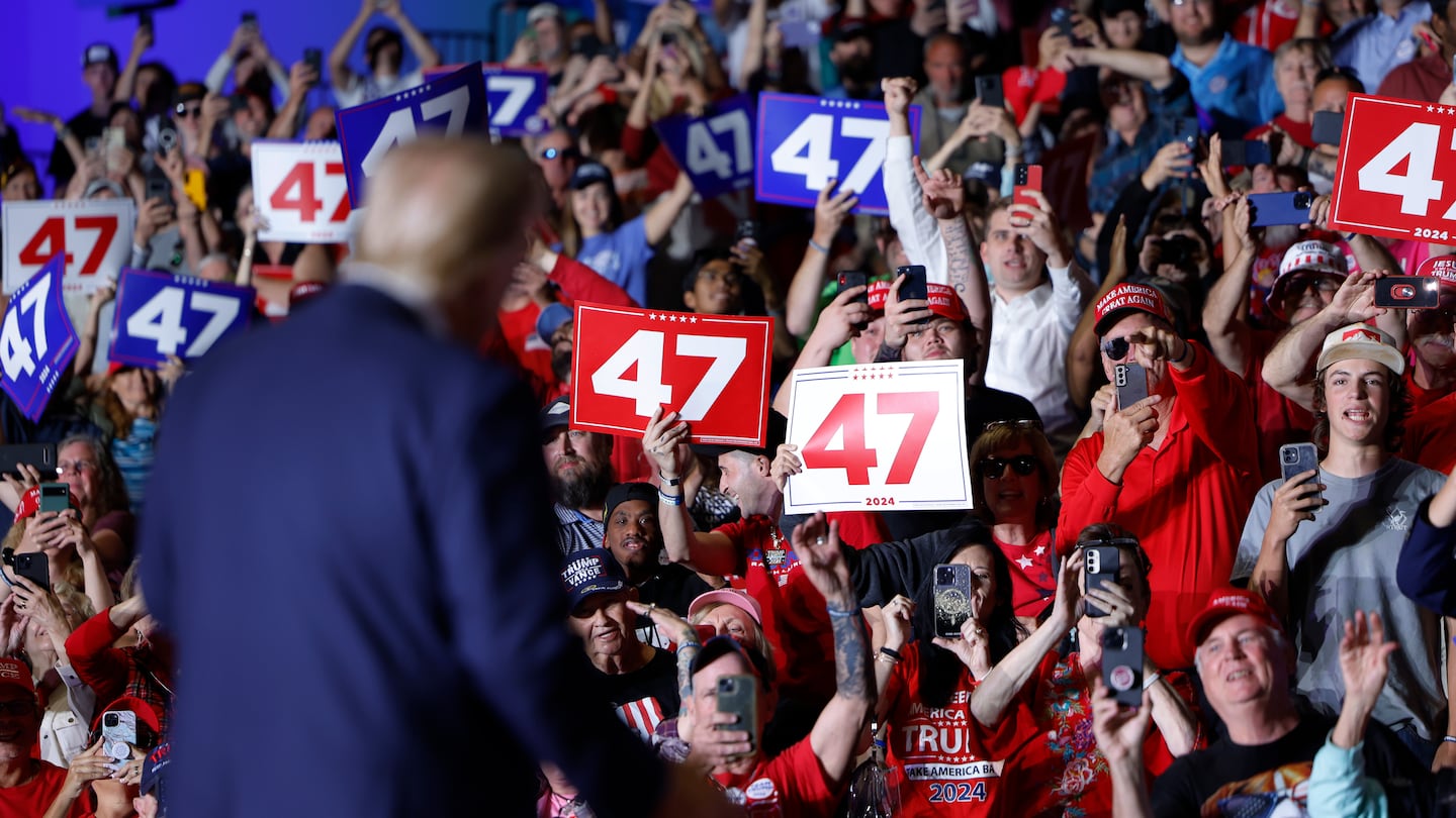 Republican presidential nominee, former president Donald Trump acknowledges supporters after speaking at a campaign rally at the Greensboro Coliseum on Oct. 22, 2024 in Greensboro, North Carolina. With 14 days to go until Election Day, Trump continues to crisscross the country campaigning to return to office.