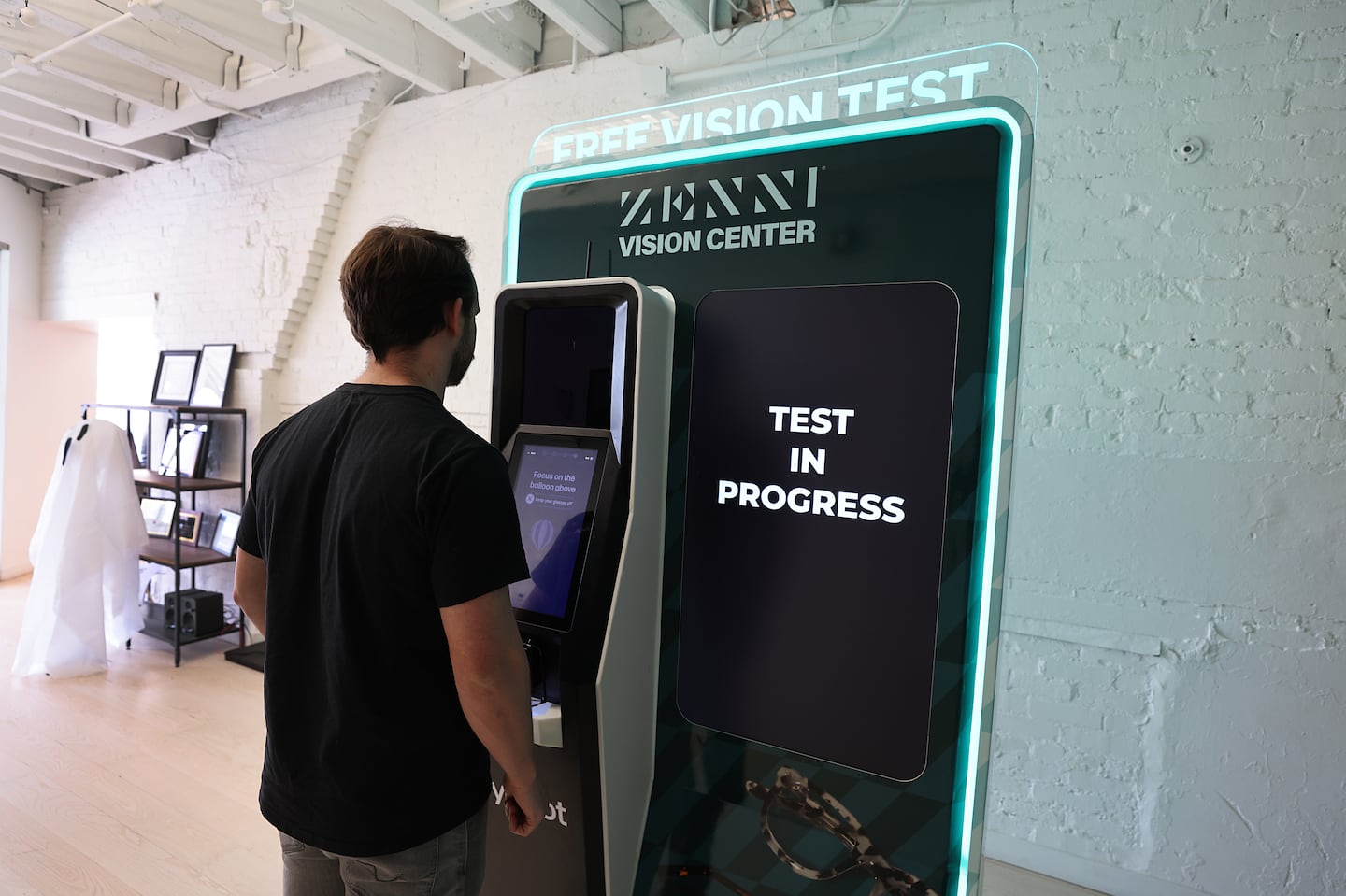 Eyebot co-founder Jack Moldave,demonstrates the robotic eye testing kiosk.