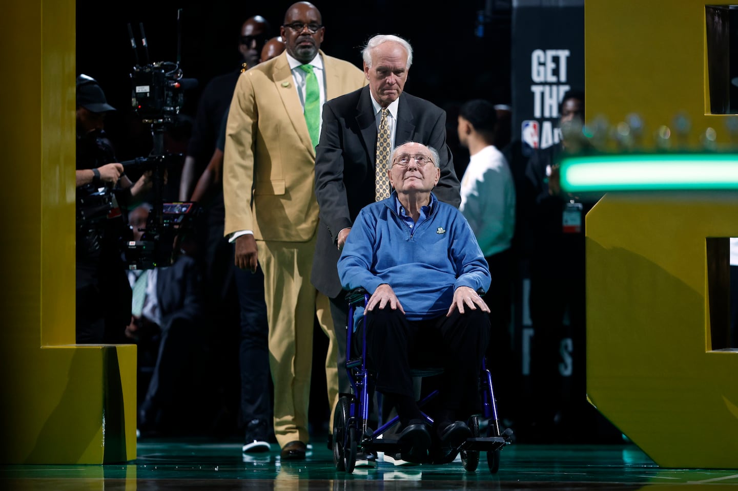 Celtics legend Bob Cousy, 96, entered the court during the NBA championship banner raising ceremony at TD Garden.