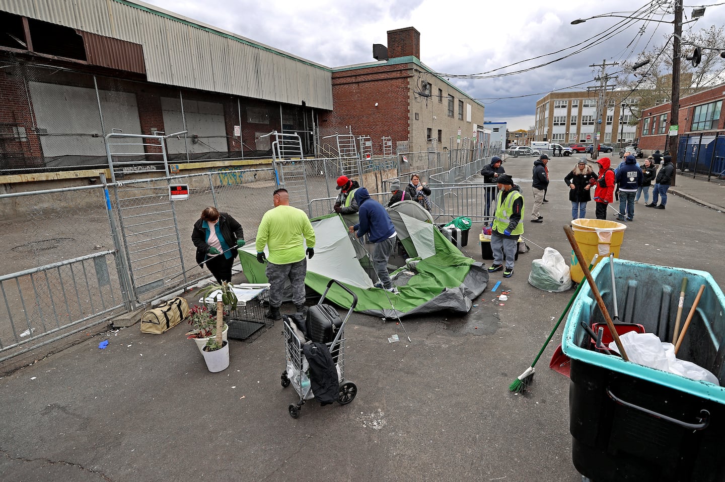 City of Boston workers disposed of tents and other items at the intersection of Melnea Cass Boulevard and Massachusetts Avenue in November 2023, as part of the city's response to the overlapping crises of substance use disorder, mental health, and homelessness.