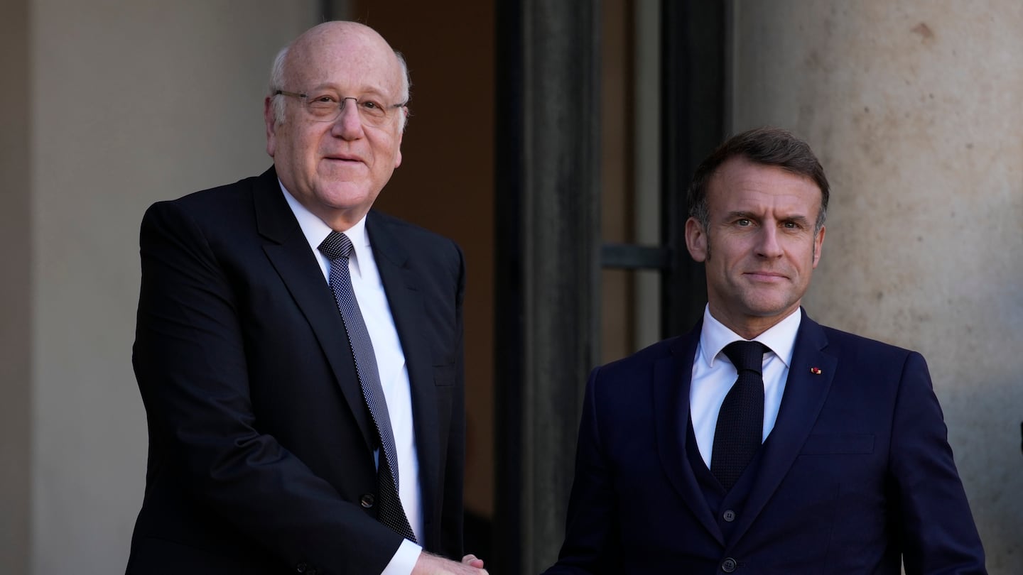 French President Emmanuel Macron welcomes Lebanese caretaker Prime Minister Najib Mikati, Oct. 23, at the Elysee Palace in Paris.