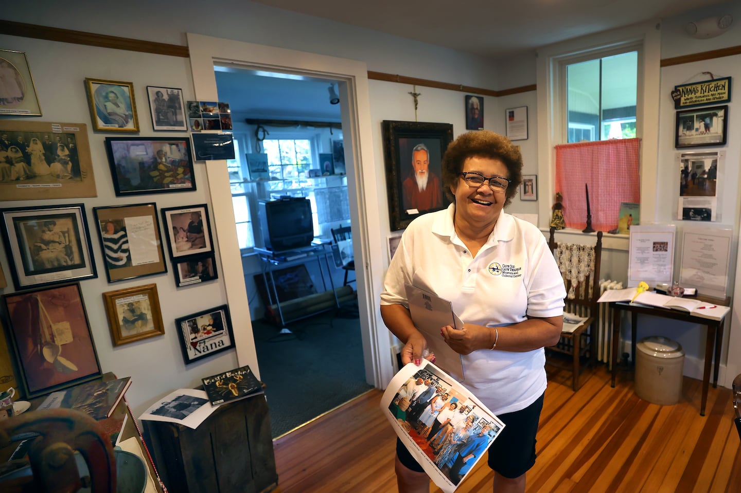 Cape Cod Cape Verdean Museum and Cultural Center curator and cofounder Barbara Burgo stands inside the Nana's Kitchen portion of the museum.