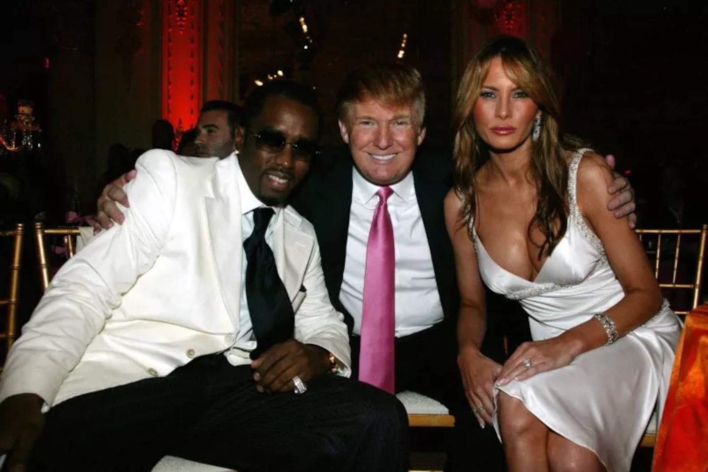 Sean “Diddy” Combs” with Donald and Melania Trump at the Art for Life gala in 2005.