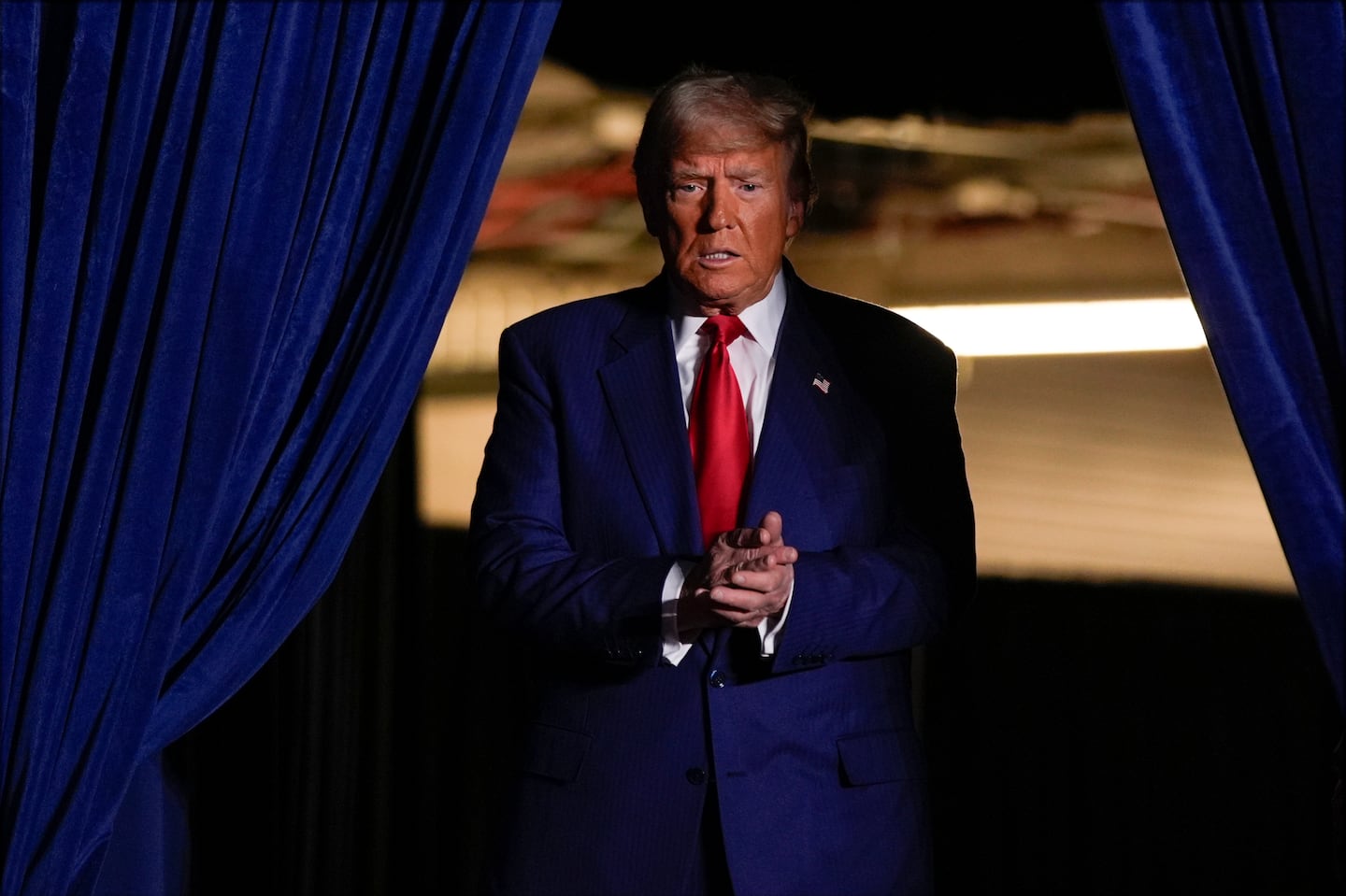 Former president Donald Trump arrives at a campaign rally at Mullett Arena, Oct. 24, in Tempe, Ariz.