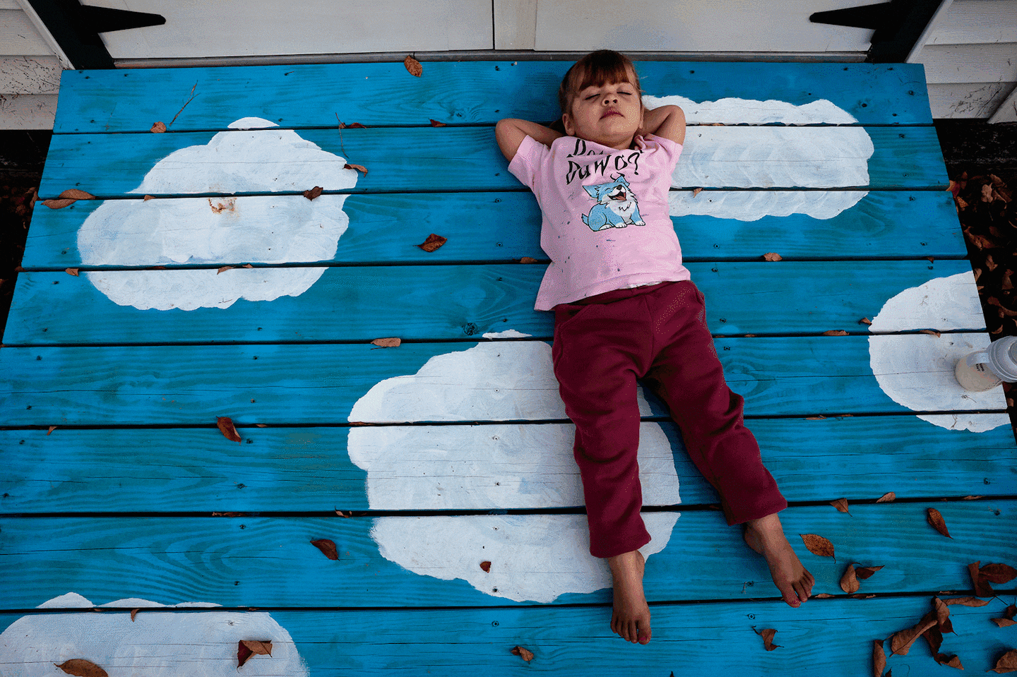 Lilian Hathaway, 2, relaxed after playing with her mother, Brenda Hathaway, and 9-month-old sister, Anna, in the backyard of their home in Lewiston on Oct. 3.. Brenda was eight months pregnant when her husband, Maxx, was killed at Schemengees Bar & Grille on Oct. 25, 2023, the night of the state’s deadliest mass shooting that claimed 18 lives at the bar and Just-In-Time Recreation.