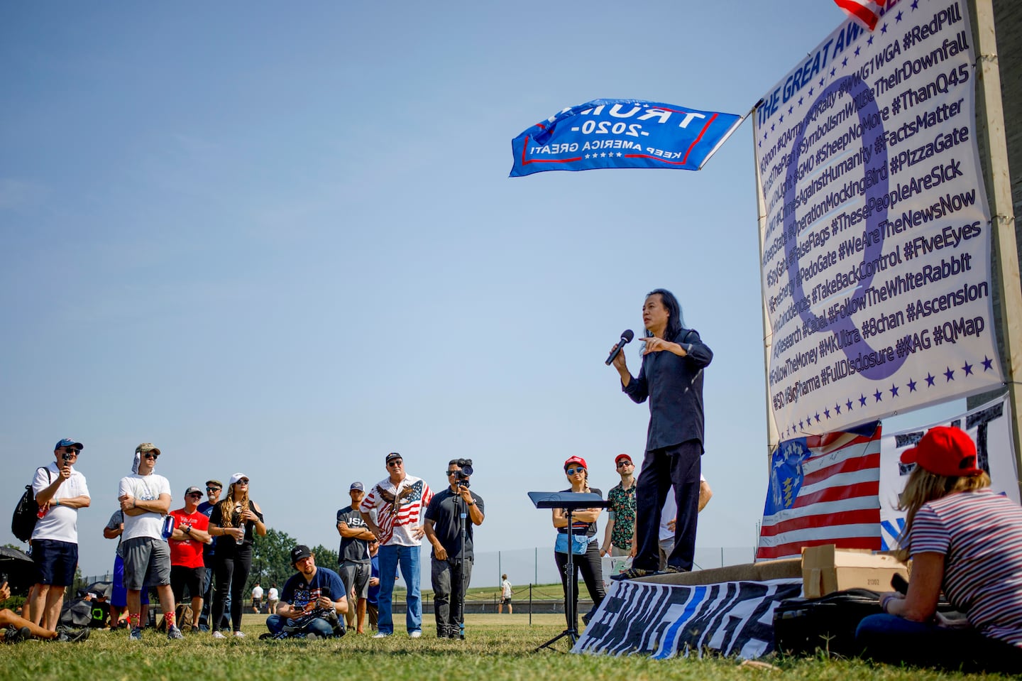 Gene Ho, a conservative conspiracy theorist, spoke at a QAnon rally at the Washington Monument in Washington, Sept. 11, 2019.